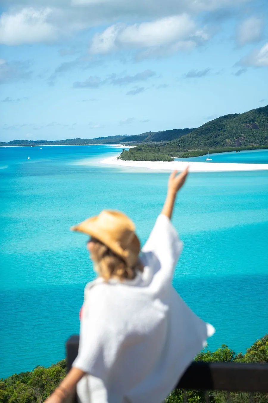 A traveller taking in the view of Hill Inlet from the lookout