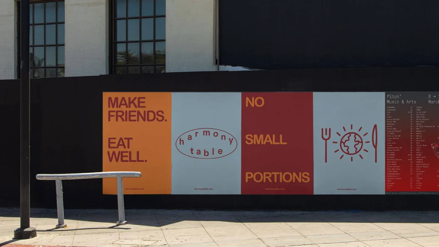 Harmony Table street hoarding with Make Friends, Eat Well and No Small Portions messaging