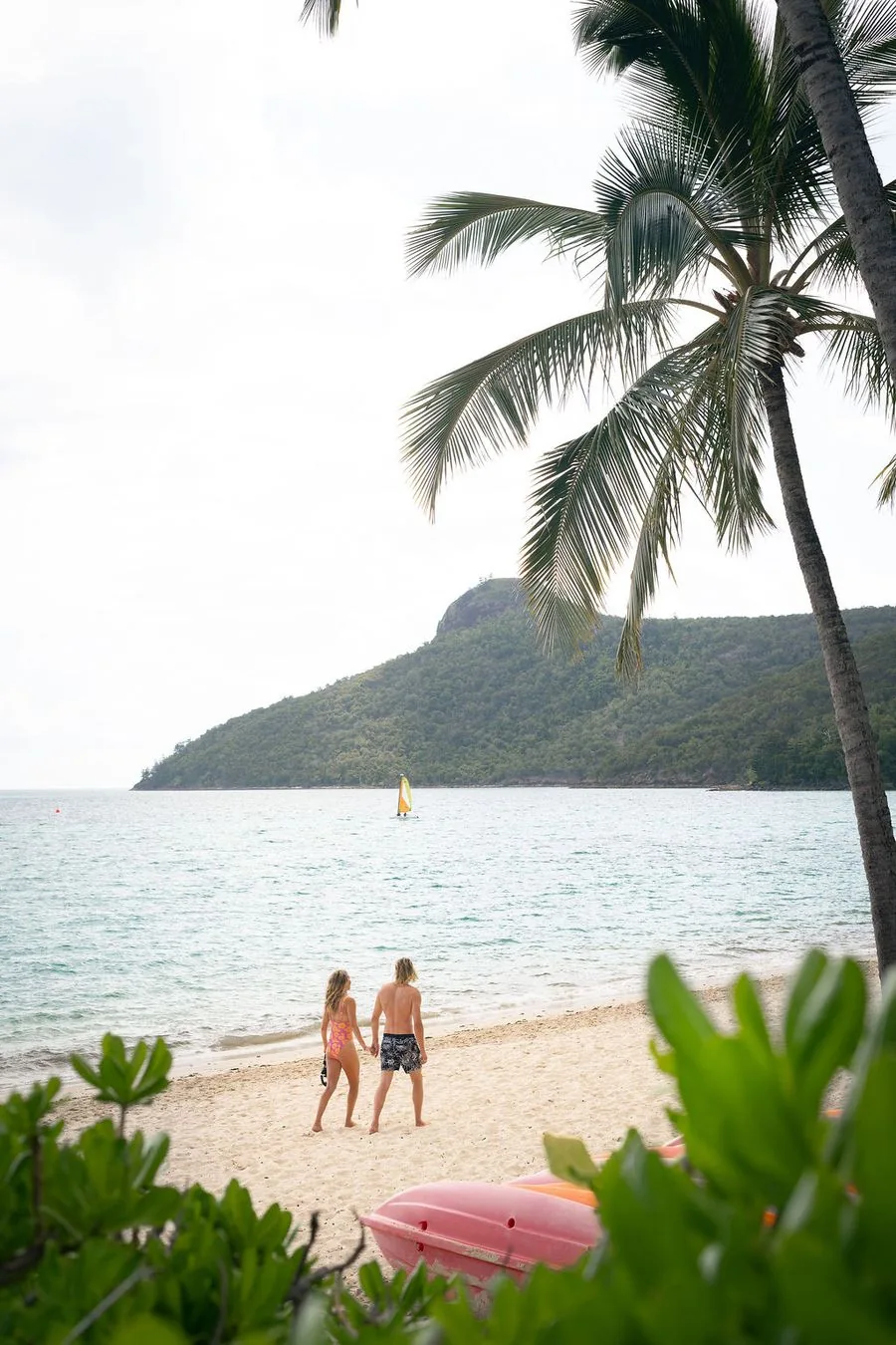 Guests on the beach at a Whitsundays island resort