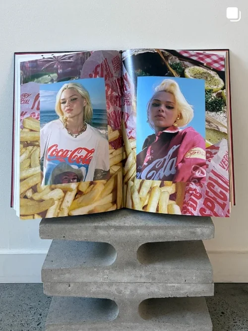 Made By Muse Instagram - Open photography book spread on a concrete plinth