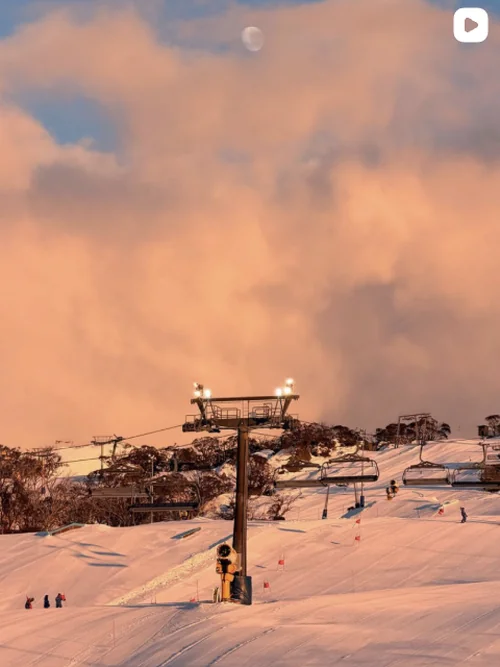 Made By Muse Instagram - Ski lift and pink clouds at sunset on a snowy mountain
