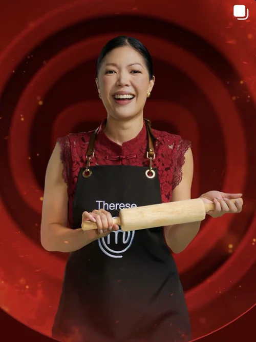 Made By Muse Instagram - Therese Lum in a MasterChef apron holding a rolling pin